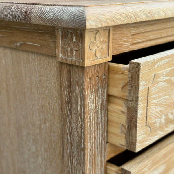 Close-up of a French Provincial Furniture Solid Wood 5 Drawer Chest of Drawers with detailed dovetail joints and a carved handle.