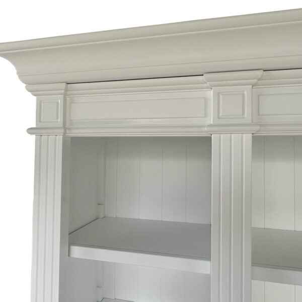 White wooden cabinet with decorative molding, vertical paneling, and crown top. Perfect for blending or complementing modern bookshelves.