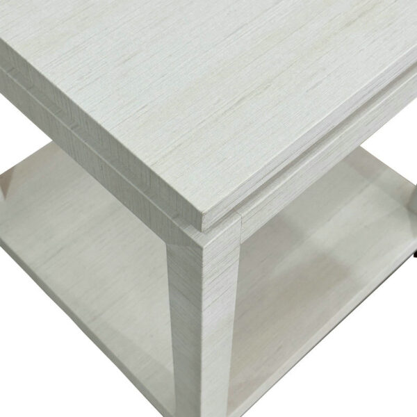 Close-up of modern, eco-friendly solid oak bedside table with light finish and lower shelf.