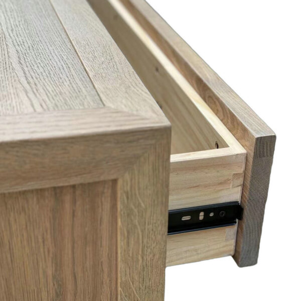 Close-up of dovetail joints and metal glides in a partially opened drawer of a French Antique Style Eco-friendly Wood Side Table.