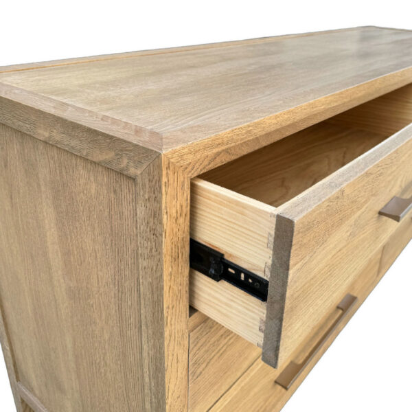 The French Oak Storage Chest features an open drawer revealing a light sliding mechanism. Its rustic design showcases natural wood grain.