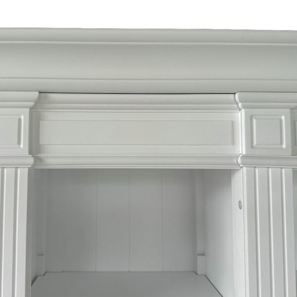 A close-up of a white fireplace mantel with decorative molding, next to a Dundee French Provincial Style white bookcase cabinet.