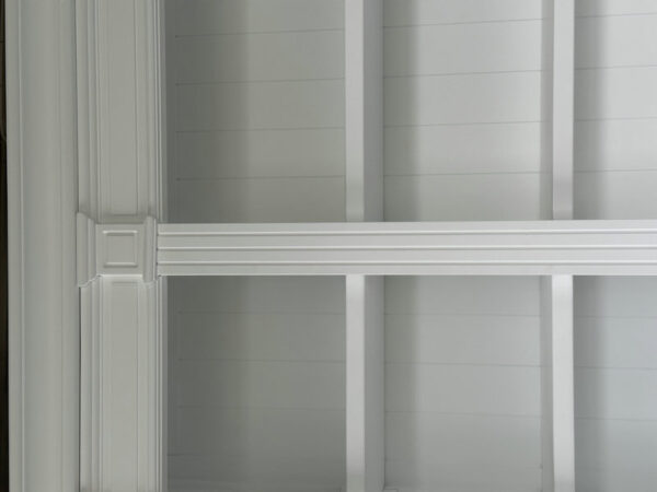 White coffered ceiling with recessed panels and beams, featuring a Dundee French Provincial white bookcase cabinet.