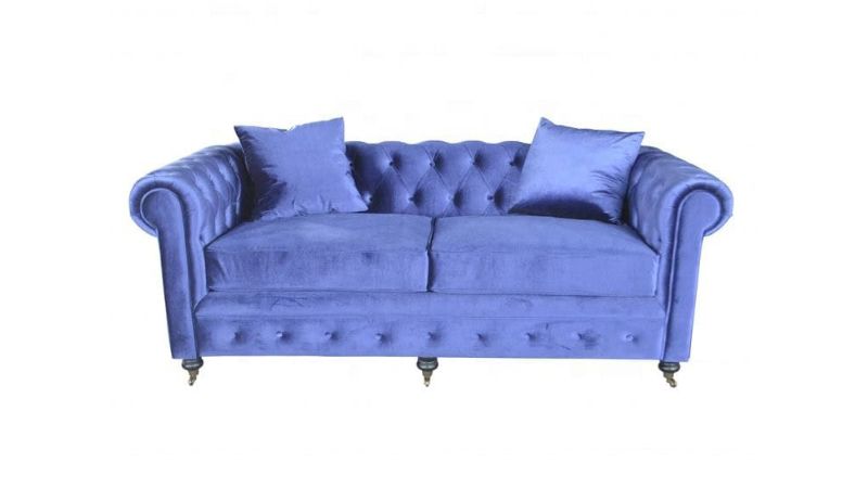 Luxurious blue velvet sofa with tufted back and rolled arms, perfect for elegant living room decor. Comfortable and stylish furniture piece from Deepblue home collection.