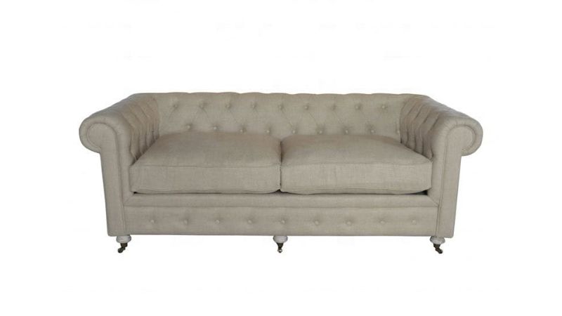 Luxurious beige tufted sofa with rolled arms and wooden legs, perfect for elegant living rooms and home decor.