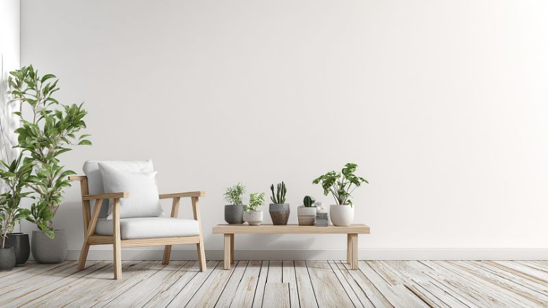 Bright, minimalist living space with natural wood accents, indoor plants, and calming neutral tones, perfect for creating a peaceful, eco-friendly home environment.