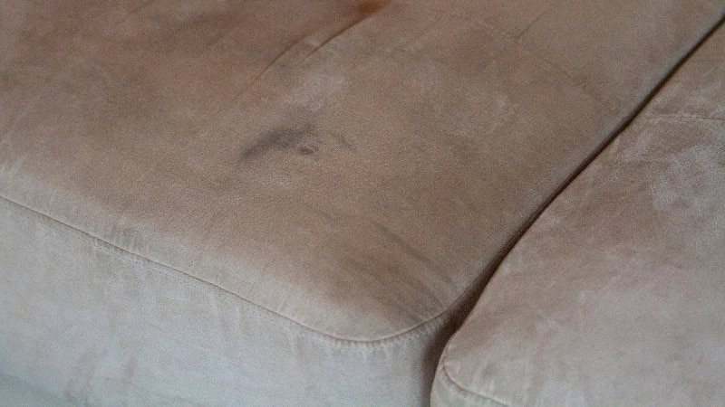 Elegant linen sofa with clean, well-maintained upholstery for a fresh look.