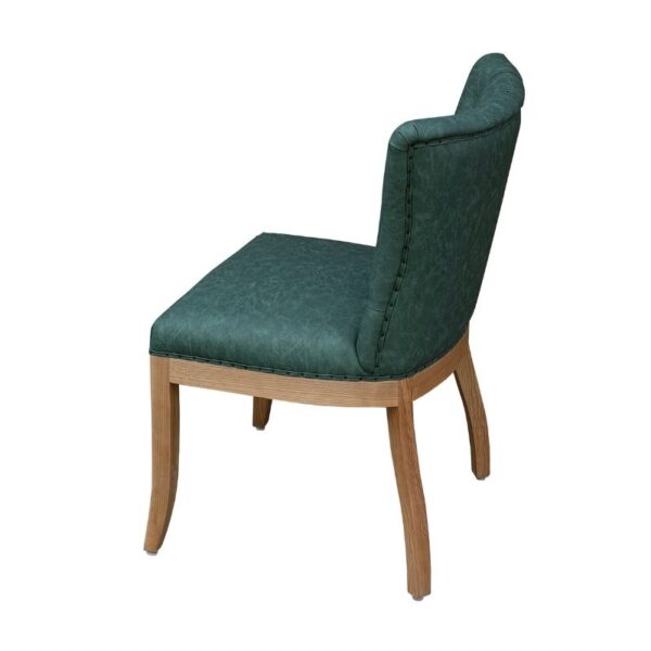 Elegant dark green dining chair with ash wood frame, inspired by French luxury design, perfect for sophisticated dining rooms.