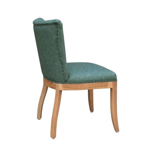 Luxurious green fabric dining chair with wooden legs, ideal for upscale dining spaces. Features a high backrest and plush cushioning, blending French elegance with contemporary design. Perfect for enh.