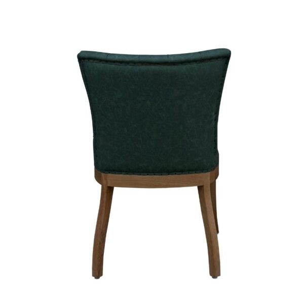 Luxurious dark green upholstered dining chair featuring a French style design, ash wood legs, and a comfortable PU leather seat, perfect for sophisticated dining spaces.