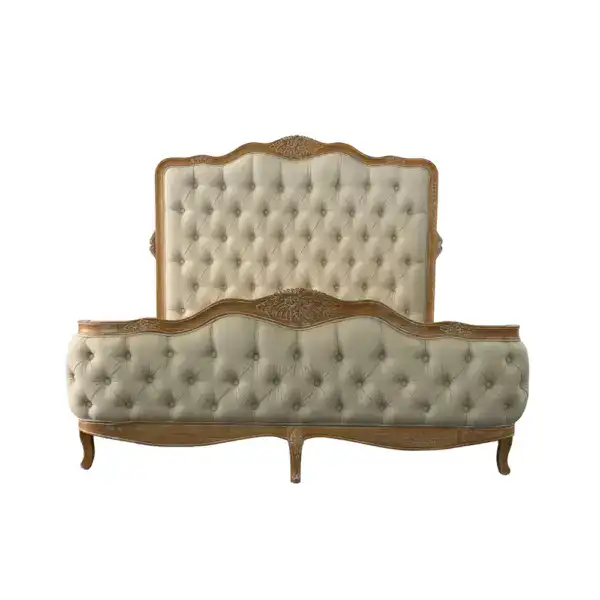 Elegant vintage upholstered bed frame featuring tufted fabric and intricate wood carvings, perfect for classic bedroom decor. Solid wood construction offers durability and timeless style.