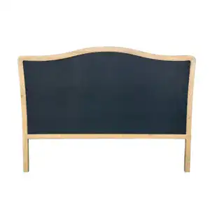 Vintage carved wooden headboard with upholstered fabric in French country style, featuring a curved top and classic design, perfect for king-sized beds.