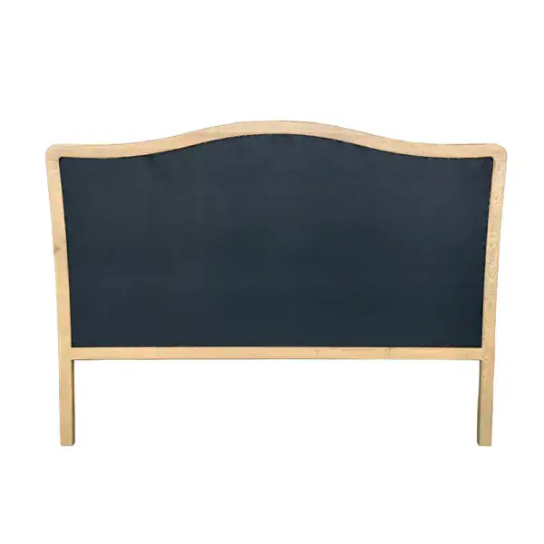 Vintage carved wooden headboard with upholstered fabric in French country style, featuring a curved top and classic design, perfect for king-sized beds.