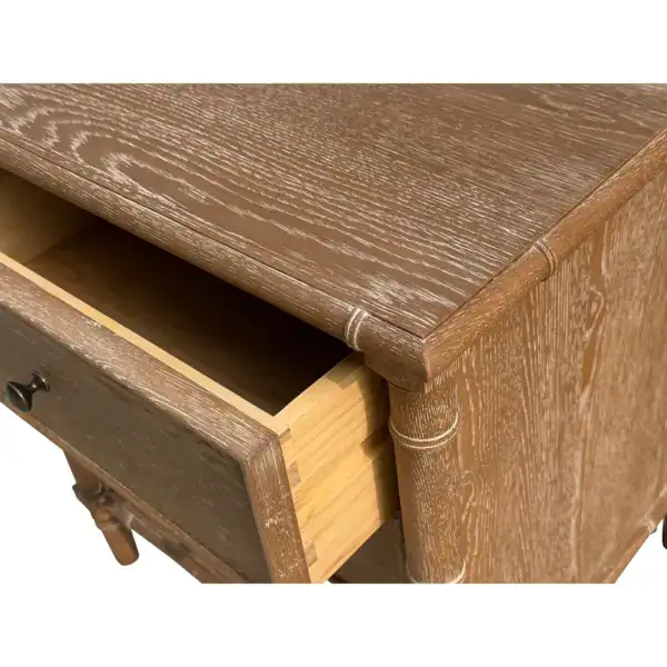 Elegant wooden bedside table featuring three spacious drawers, ideal for bedroom storage and organization. Crafted from high-quality wood with a natural finish, perfect for complementing various bedro.