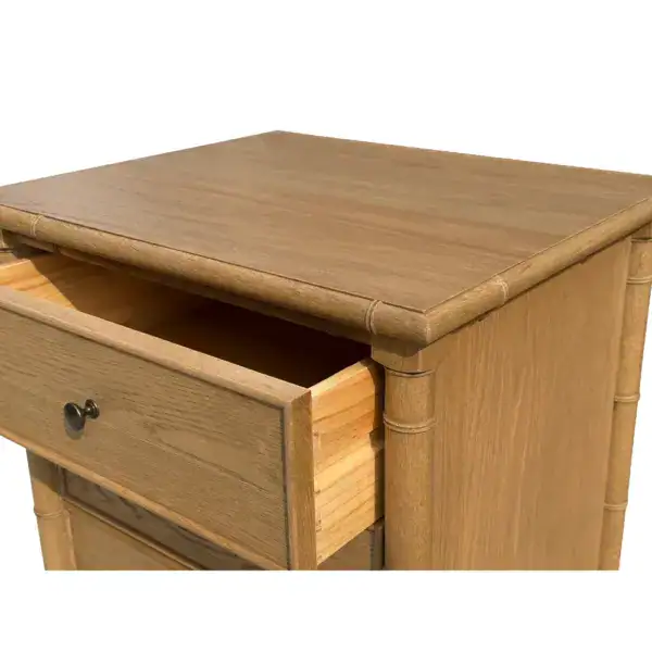 Wooden bedside table featuring three spacious drawers, ideal for bedroom storage and organization. Crafted from high-quality wood, this bedside cabinet combines functionality with elegant design.