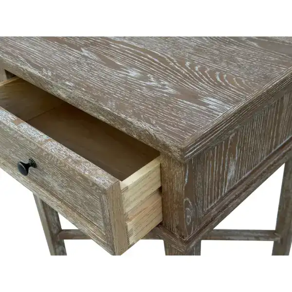 Antique wooden side table featuring a single drawer with a black knob, showcasing rustic charm and distressed finish. Perfect for vintage or shabby chic decor.