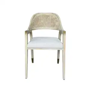 Elegant vintage French rattan dining chair with a woven cane backrest and a soft linen cushion for added comfort. Perfect for classic or rustic dining room decor.