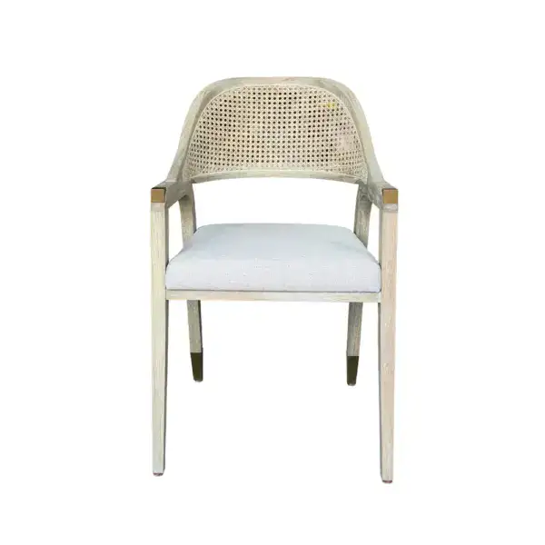 Elegant vintage French rattan dining chair with a woven cane backrest and a soft linen cushion for added comfort. Perfect for classic or rustic dining room decor.