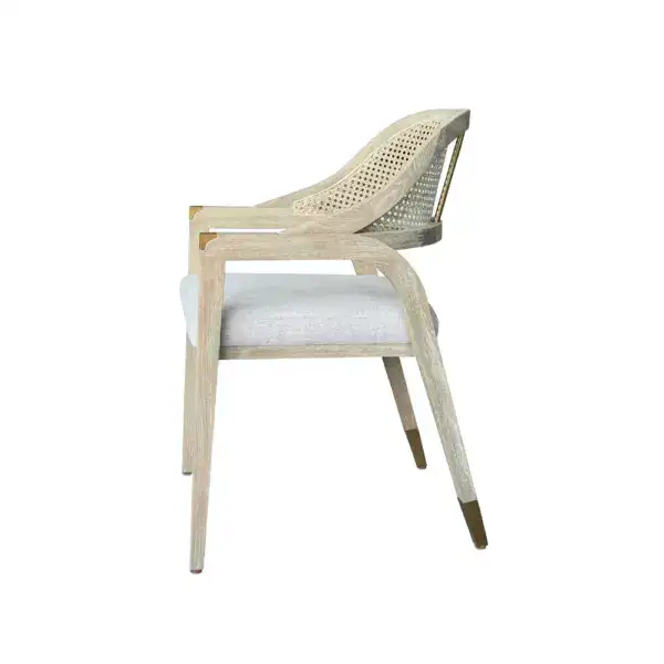 French rattan dining chair with vintage design and linen cushion, perfect for elegant dining spaces. Crafted with natural rattan and a comfortable linen seat, ideal for stylish home decor.