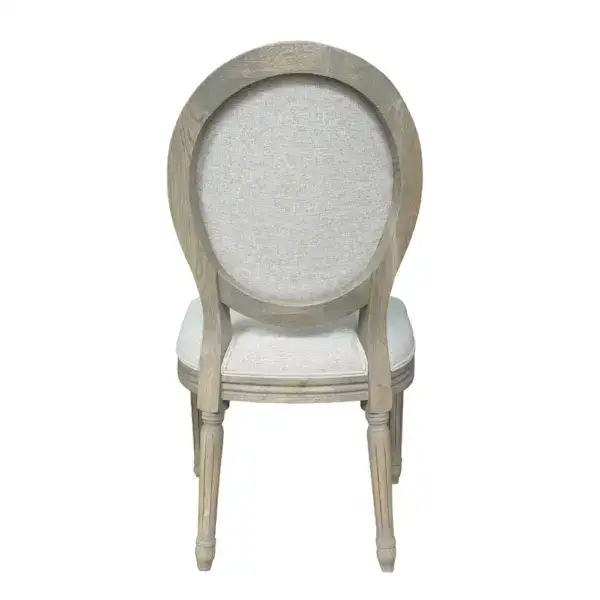 Antique-style Louis oval back dining chair with distressed wood finish and upholstered seat, perfect for classic French interior decor. Ideal for elegant dining rooms and vintage-inspired spaces.