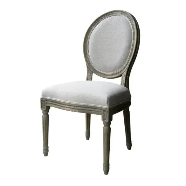 Elegant French antique Louis-style oval back dining chair with carved wooden frame and light upholstery. Perfect for classic dining rooms, showcasing vintage craftsmanship and timeless design.