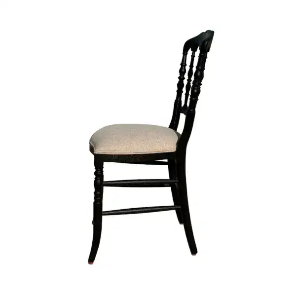 Antique style solid oak wood Regency dining chair with a black finish and beige upholstered seat, featuring classic turned spindles and elegant design suitable for vintage or traditional dining rooms.