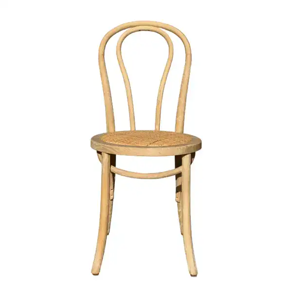 Elegant vintage French-style rattan and bentwood dining chair with a curved backrest and woven seat, perfect for classic and rustic interior decor.
