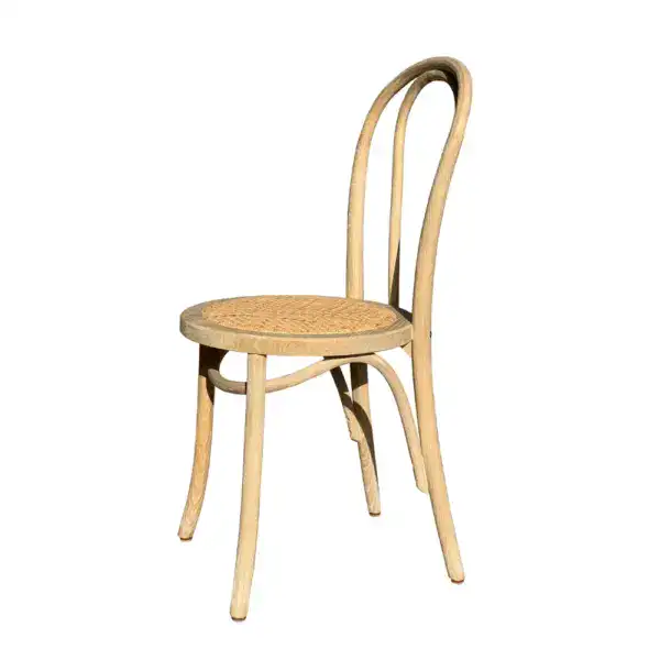 Elegant vintage French style rattan and bentwood dining chair with curved backrest and woven seat, perfect for classic or rustic interior decor.