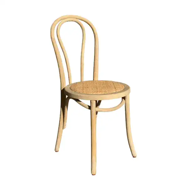 Vintage French style rattan and bentwood dining chair with a woven seat, elegant curved backrest, and classic design perfect for rustic or vintage-inspired interiors.