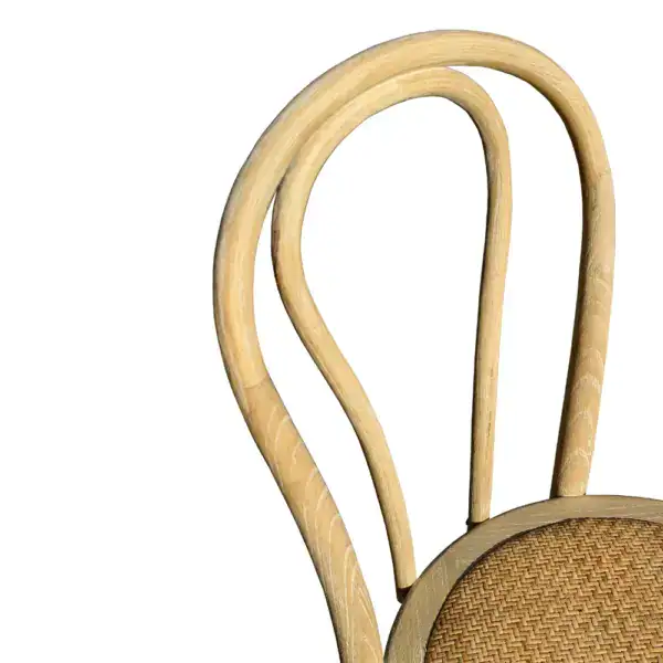 Vintage French style rattan and bentwood dining chair with curved backrest and woven seat, perfect for classic and rustic interior decor.