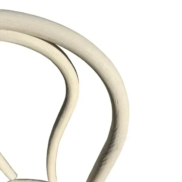 Elegant vintage French-style rattan and bentwood dining chair with curved design and distressed white finish, perfect for classic or shabby chic interior decor.